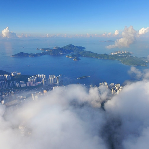 an aerial view of a city from the clouds