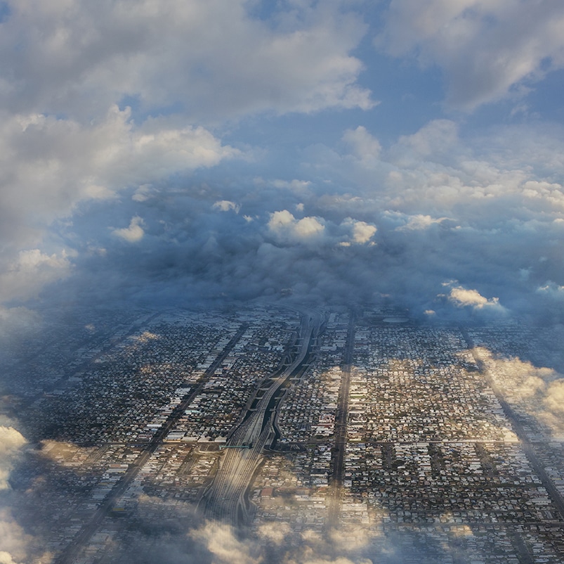 a cloudy aerial view of a large city