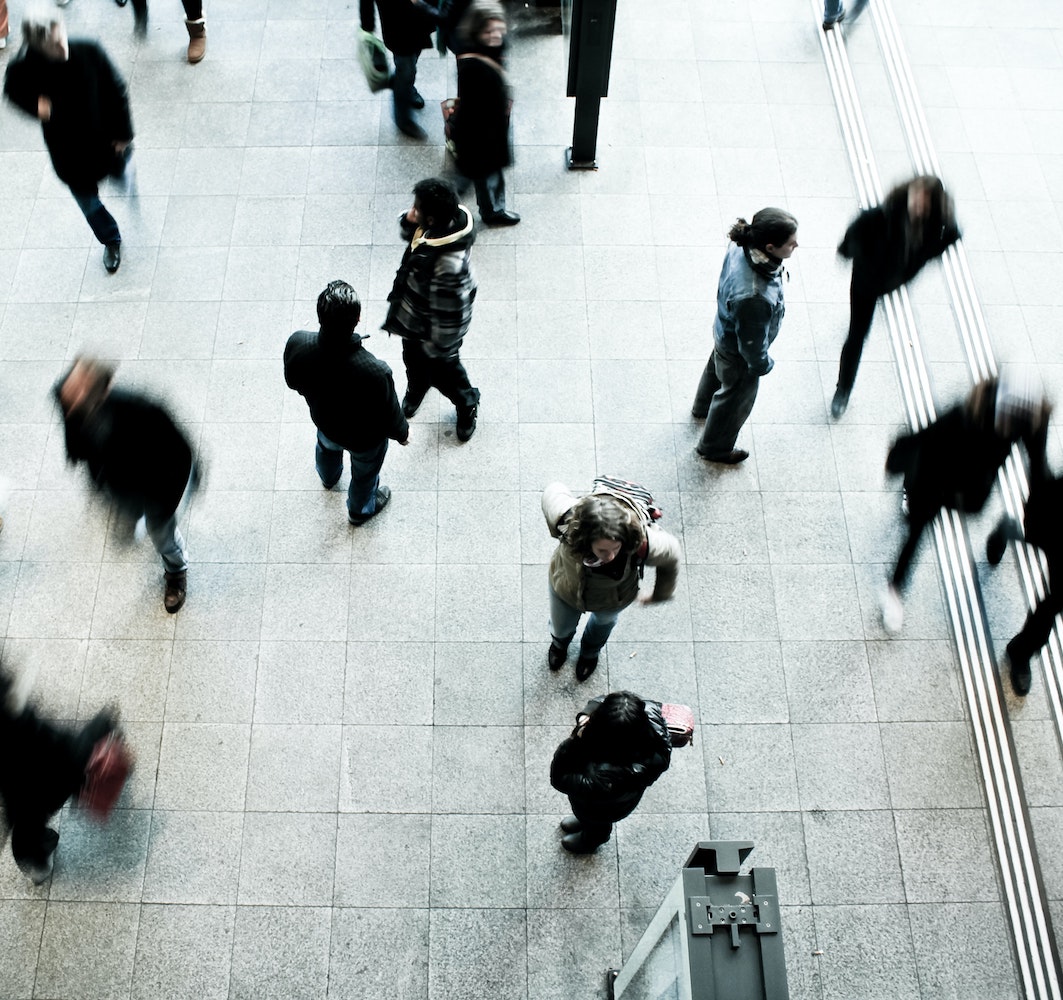 a top down view of a group of people walking around