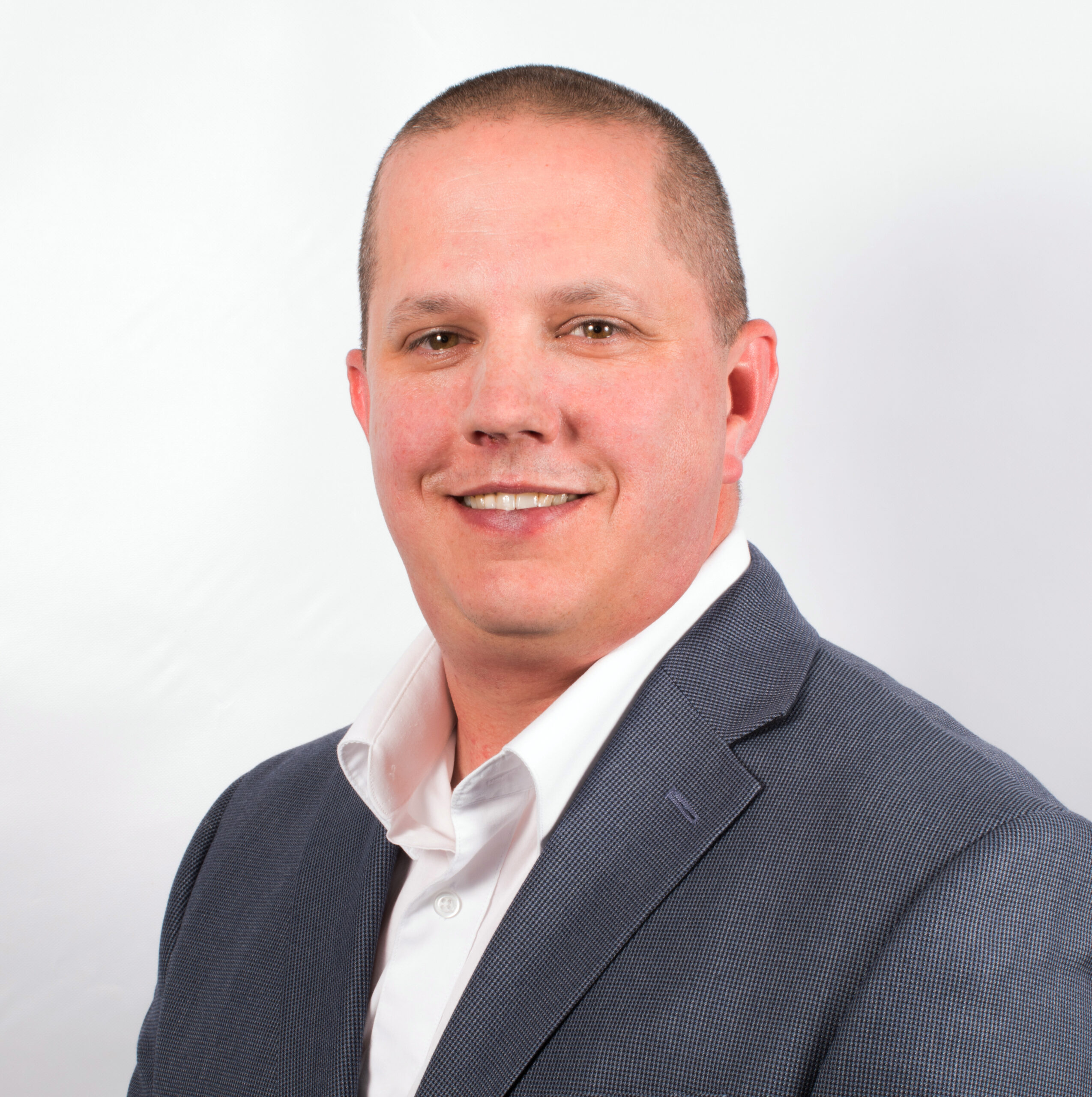 a man in a suit and tie posing for a picture