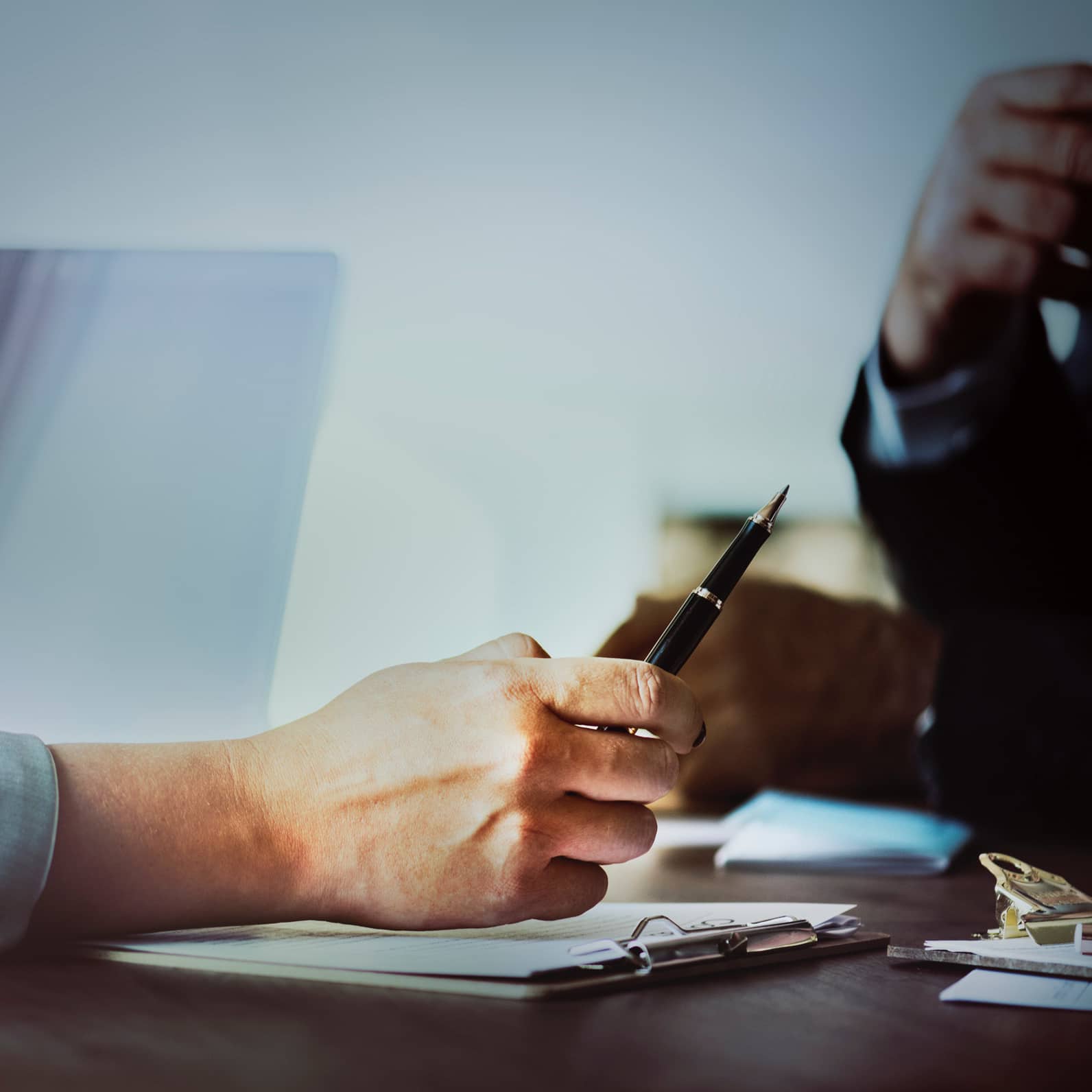 a person holding a pen