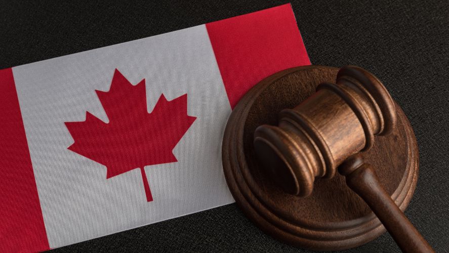 canadian flag and a wooden gavel