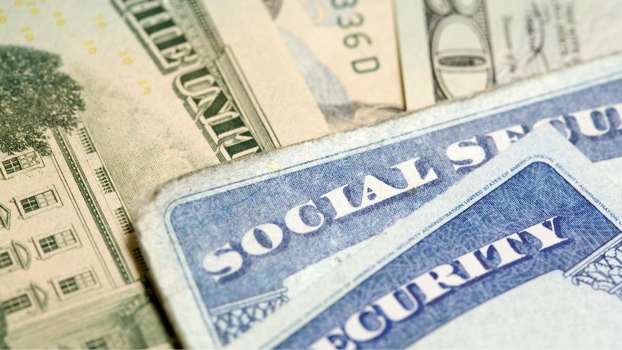 a stack of money and social security cards close-up